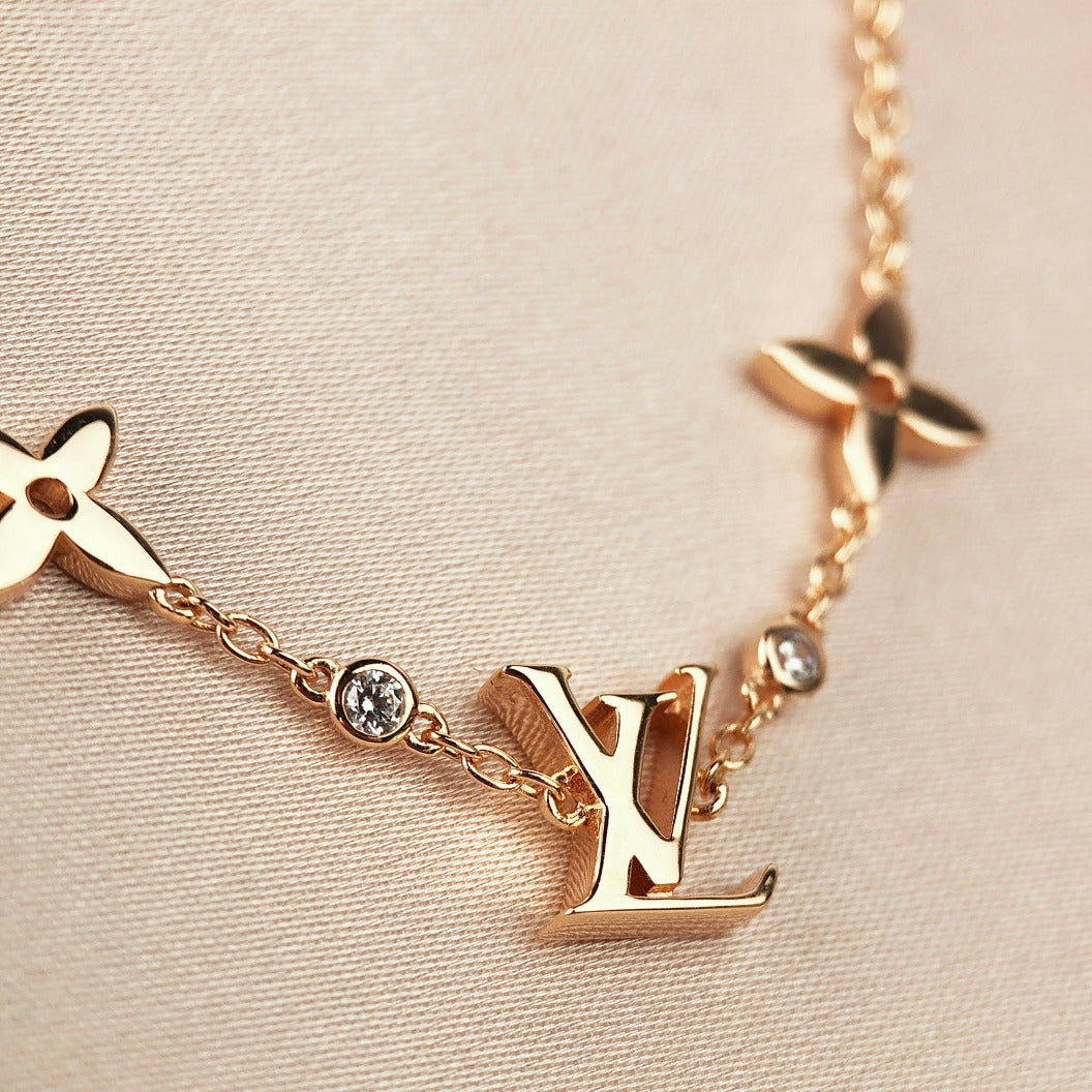 DIANA STAR AND SUN 7 MOTIFS GOLD BRACELET