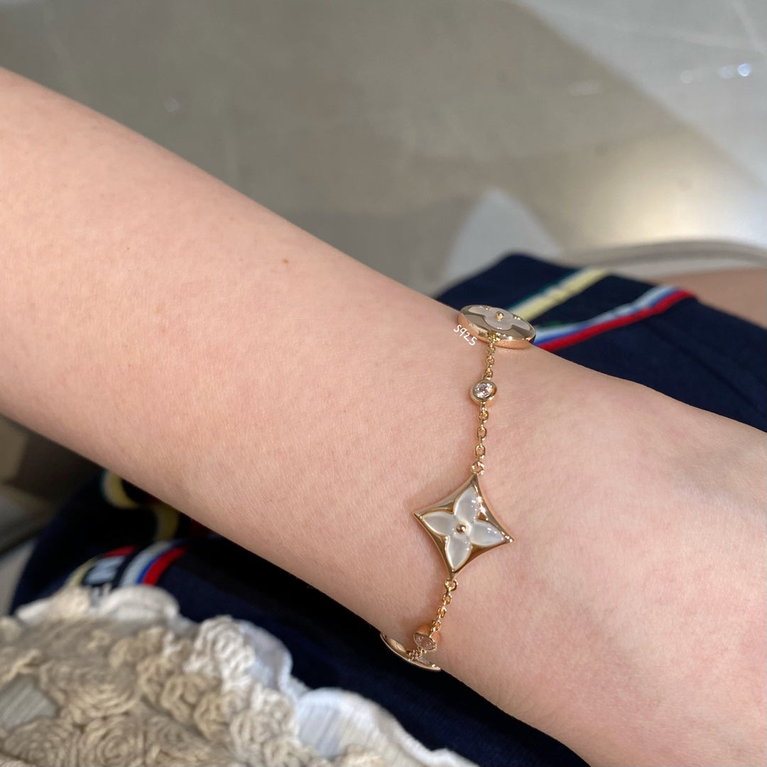 DIANA STAR AND SUN 4 MOTIF WHITE MOP PINK GOLD BRACELET