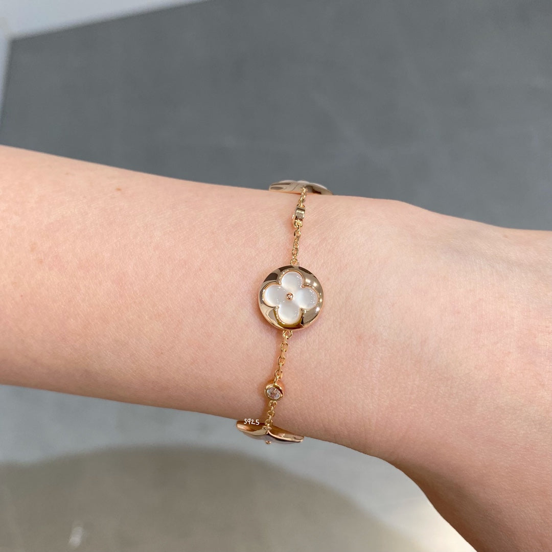 DIANA STAR AND SUN 4 MOTIF WHITE MOP PINK GOLD BRACELET