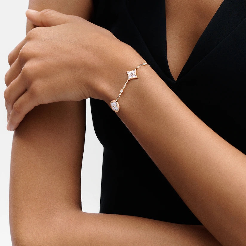 DIANA STAR AND SUN 4 MOTIF WHITE MOP PINK GOLD BRACELET