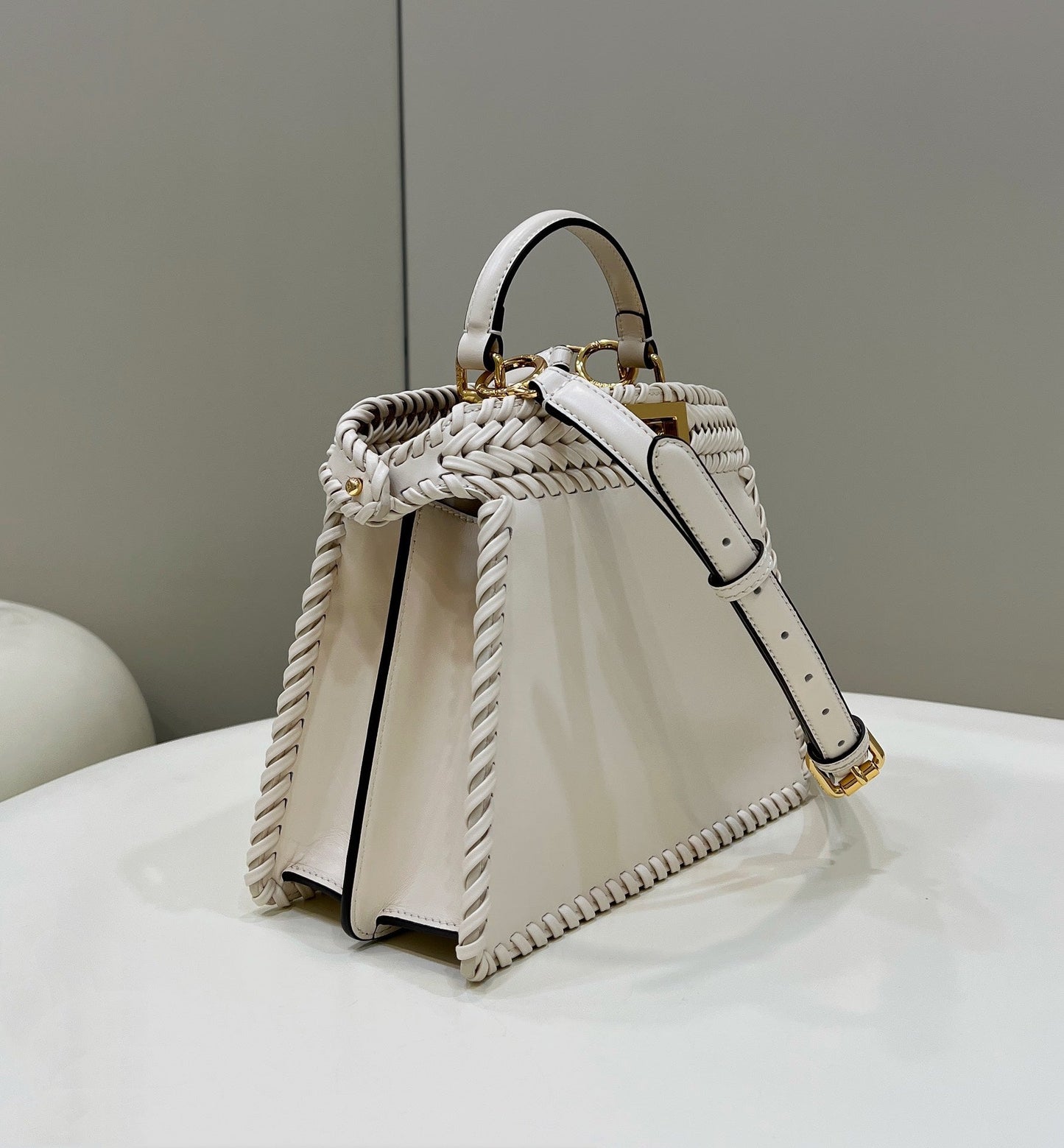 PEEKABOO ISEEU 27 IN WHITE SMOOTH CALFSKIN WITH WOVEN TRIM GOLD HARDWARE