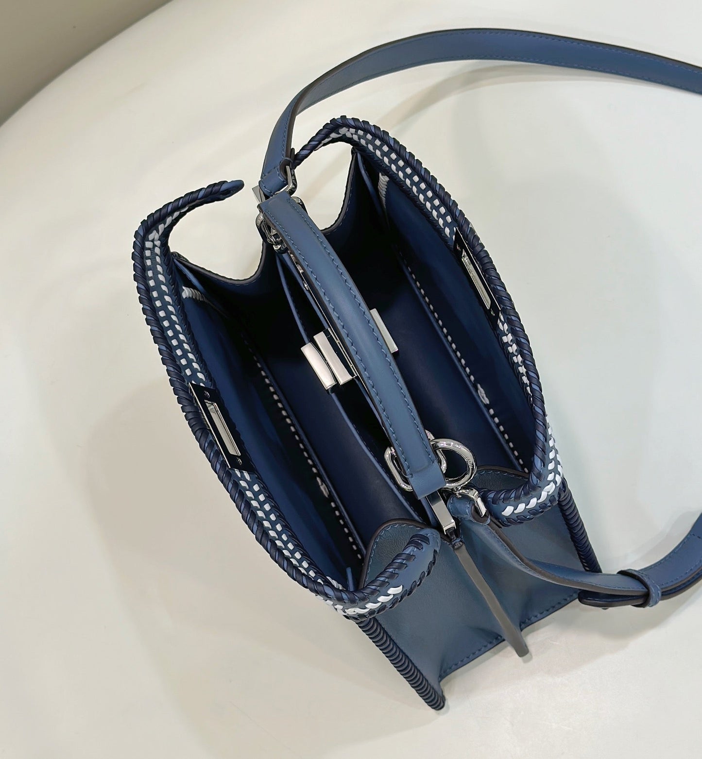 PEEKABOO ISEEU 27 IN BLUE BAYOUX INTERLACED CALFSKIN SILVER HARDWARE