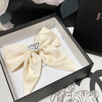 BOW-KNOT HAIR CLIP IN EGG SHELL SILK 358294