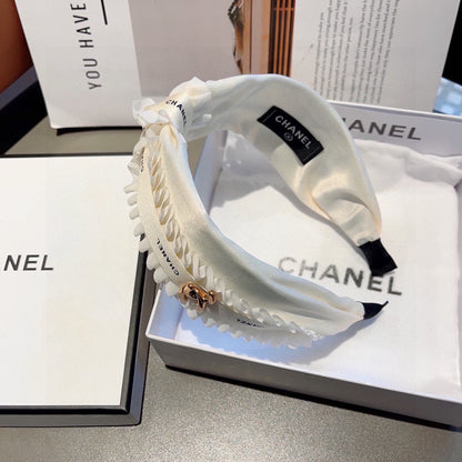 WHITE FABRIC WITH GOLD LOGO HAIRBAND 410841